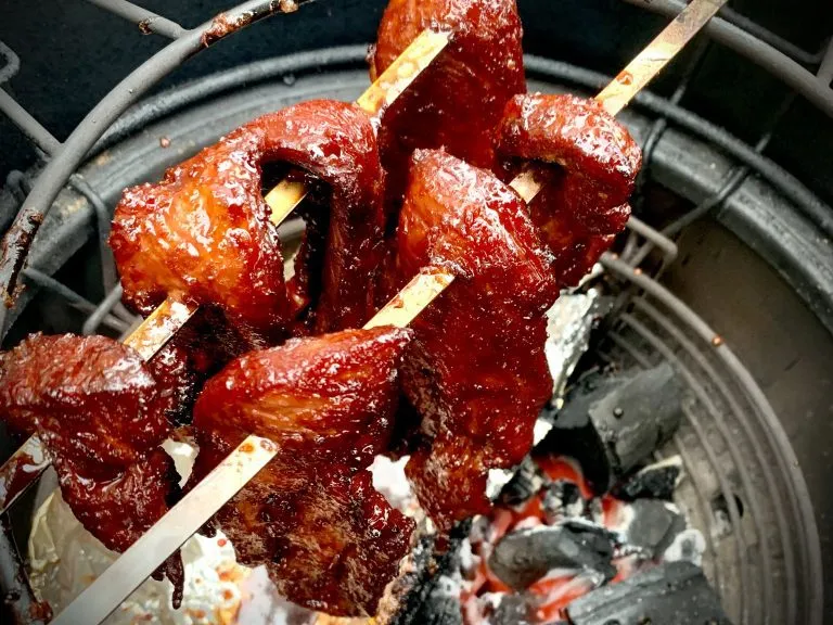 Char siu pork on the kamado, slightly charred around the edges