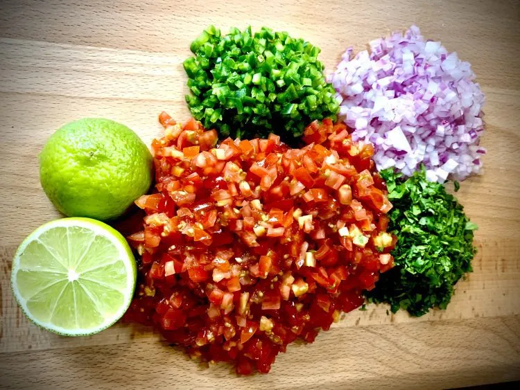 Pico de gallo ingredients finely chopped by hand