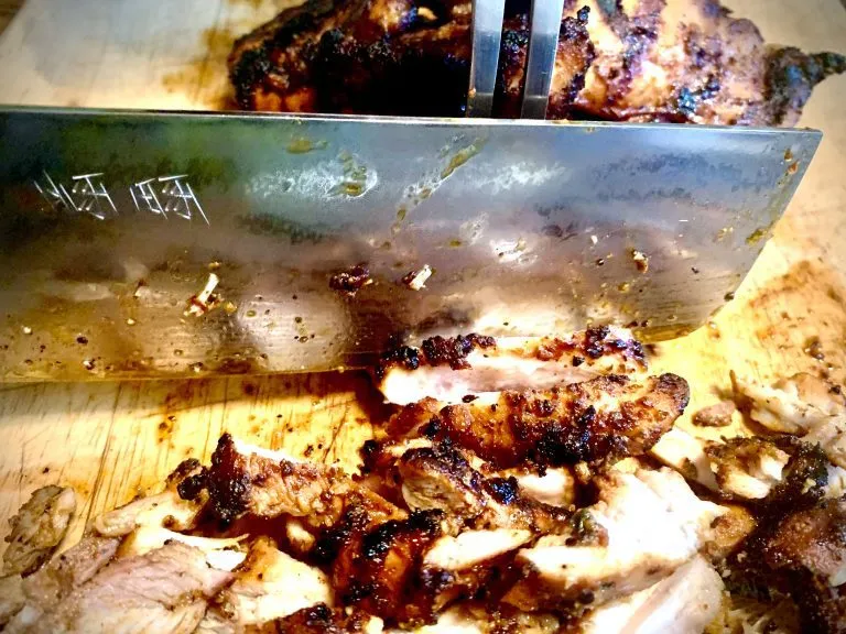 Charred chicken thinly sliced with a sharp knife